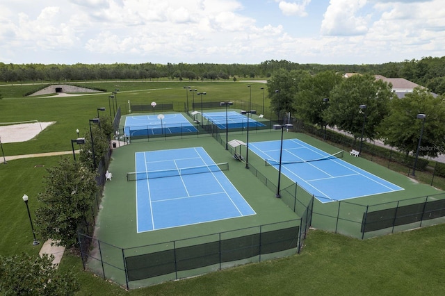 21590 Violet Periwinkle Dr, Land O Lakes, FL 34637 - view of tennis court featuring fence and a yard
