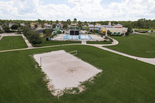 21590 Violet Periwinkle Dr, Land O Lakes, FL 34637 - view of property's community with volleyball court, a swimming pool, and a yard