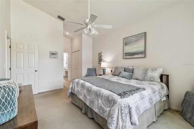 bedroom with light carpet, baseboards, a closet, and visible vents