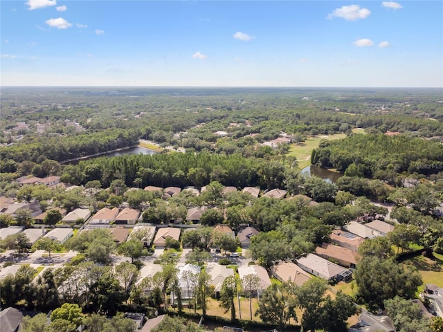 birds eye view of property with a water view, a forest view, and a residential view