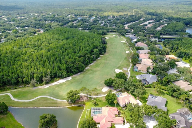 aerial view with a water view, view of golf course, a forest view, and a residential view