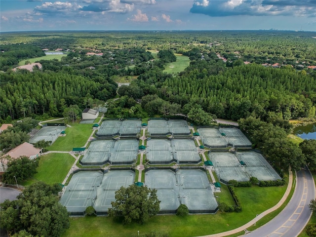birds eye view of property featuring a wooded view