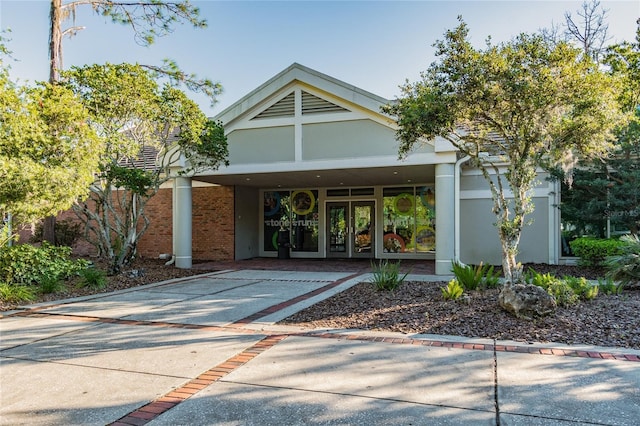 view of exterior entry featuring french doors