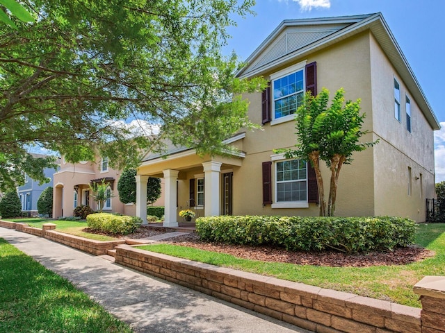 traditional-style house with stucco siding