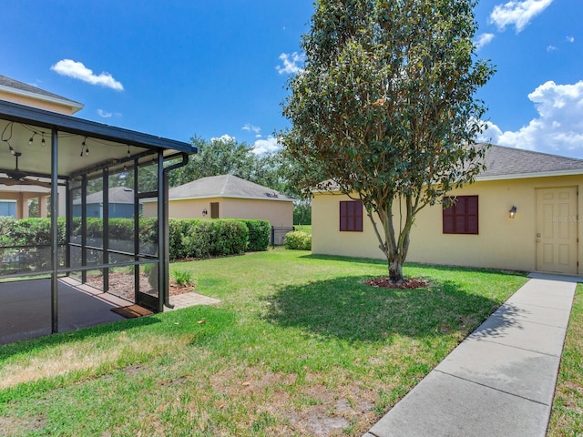 view of yard with a sunroom