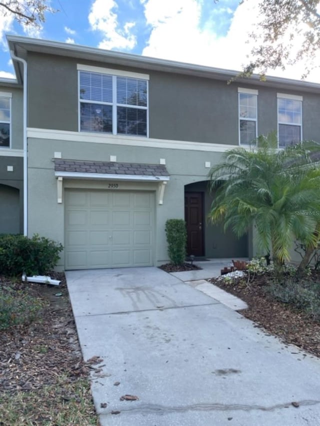 2950 Willowleaf Ln, Wesley Chapel, FL 33544 - traditional-style house featuring a garage and stucco siding