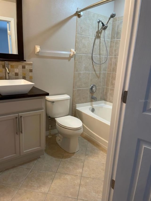 2950 Willowleaf Ln, Wesley Chapel, FL 33544 - full bathroom featuring tile patterned flooring, vanity, toilet, backsplash, and shower / washtub combination