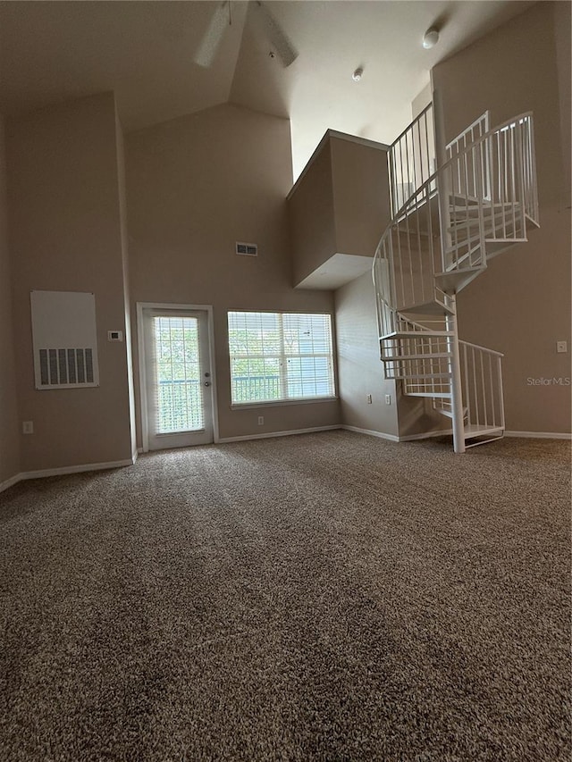 1530 Villa Capri Cir Unit 302, Odessa, FL 33556 - unfurnished living room featuring high vaulted ceiling, baseboards, carpet floors, and visible vents