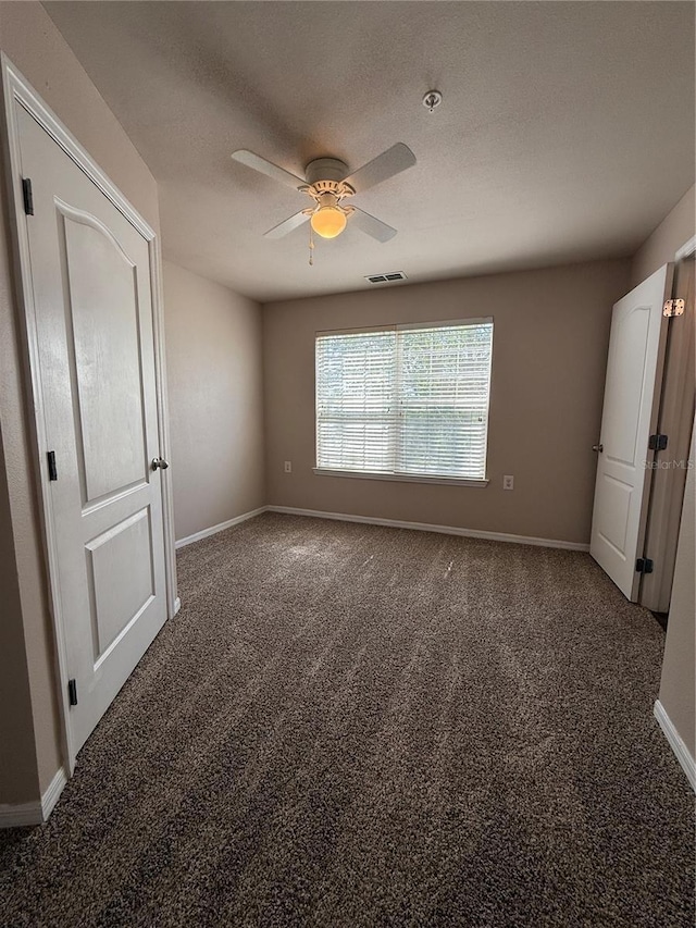 1530 Villa Capri Cir Unit 302, Odessa, FL 33556 - unfurnished bedroom with carpet floors, a ceiling fan, baseboards, and visible vents