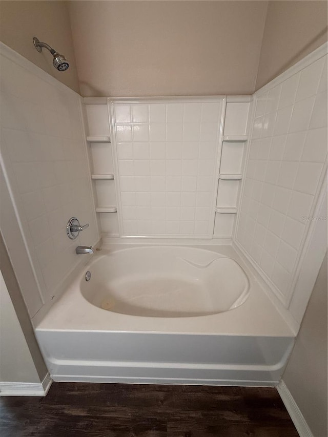 1530 Villa Capri Cir Unit 302, Odessa, FL 33556 - bathroom with baseboards, shower / tub combination, and wood finished floors
