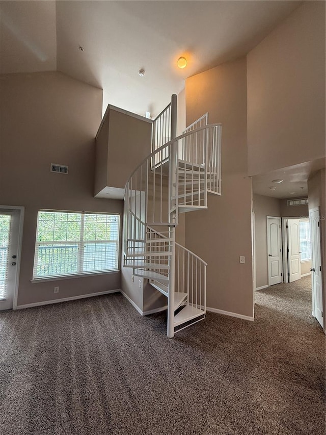 1530 Villa Capri Cir Unit 302, Odessa, FL 33556 - staircase with a high ceiling, visible vents, baseboards, and carpet