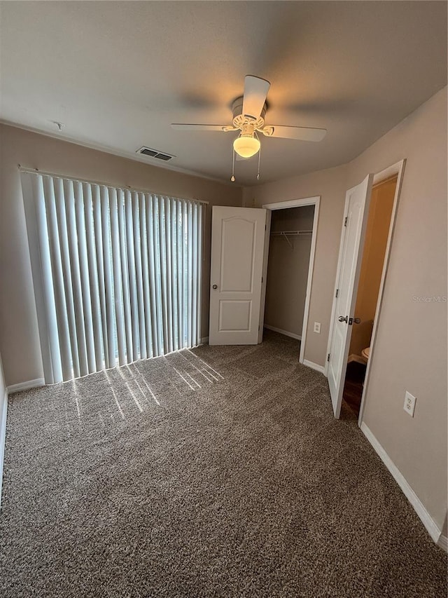 1530 Villa Capri Cir Unit 302, Odessa, FL 33556 - unfurnished bedroom with visible vents, carpet floors, a closet, baseboards, and a ceiling fan