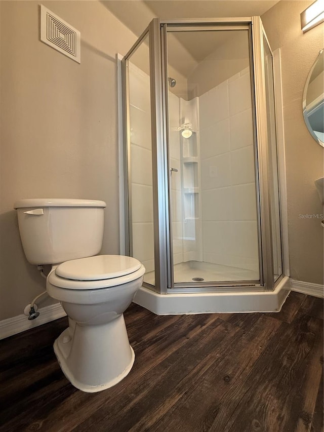 1530 Villa Capri Cir Unit 302, Odessa, FL 33556 - bathroom with baseboards, a shower stall, wood finished floors, and visible vents