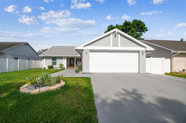 ranch-style house featuring a garage, a front lawn, fence, and driveway