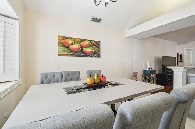 dining space featuring visible vents