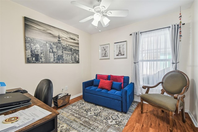 office with baseboards, ceiling fan, and wood finished floors