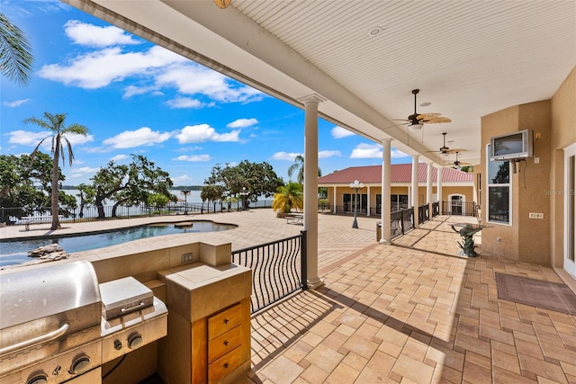 view of patio / terrace featuring area for grilling, fence, a ceiling fan, and a grill