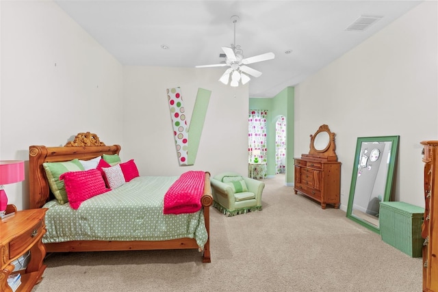 bedroom with ceiling fan, visible vents, and carpet