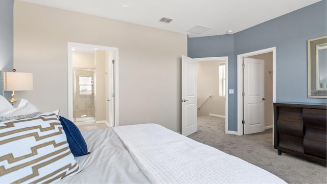 bedroom with visible vents, carpet flooring, baseboards, and ensuite bathroom