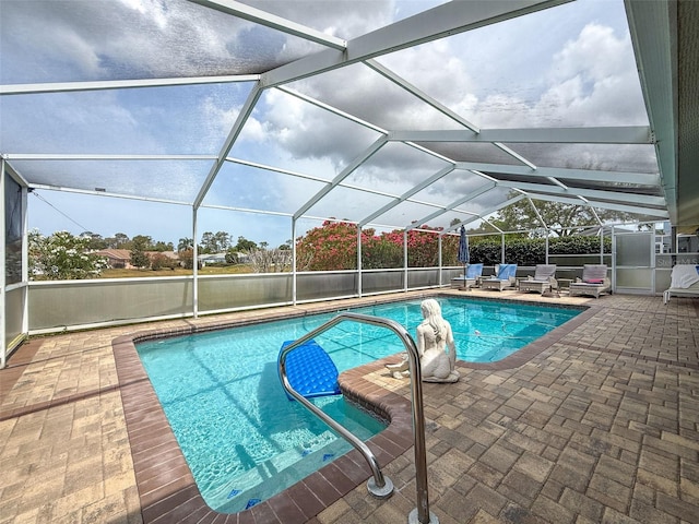 view of swimming pool featuring a patio area, a fenced in pool, and glass enclosure