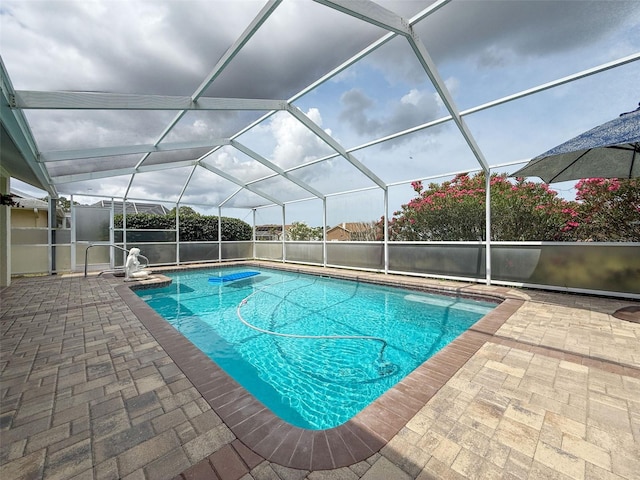 outdoor pool featuring a patio and a lanai