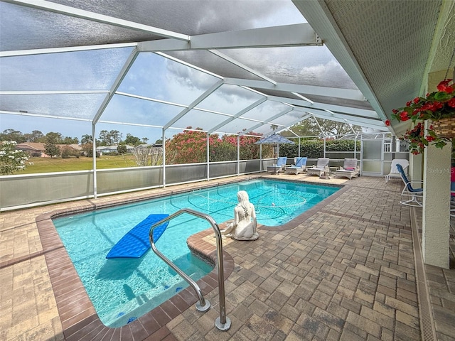 view of pool featuring a patio area, a fenced in pool, and glass enclosure