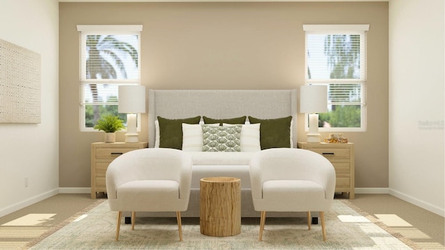 bedroom featuring carpet floors and baseboards
