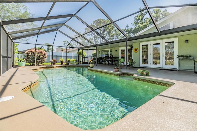 view of swimming pool with a patio, fence, french doors, and a fenced in pool