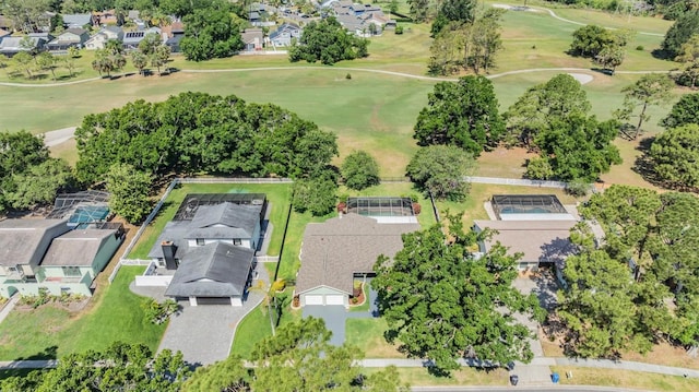 birds eye view of property featuring view of golf course and a residential view