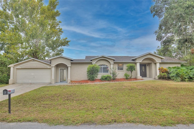 ranch-style home with concrete driveway, a garage, a front yard, and stucco siding