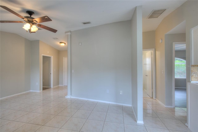 unfurnished room with light tile patterned floors, visible vents, ceiling fan, and lofted ceiling