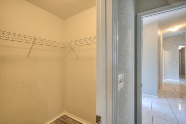 walk in closet featuring light tile patterned floors