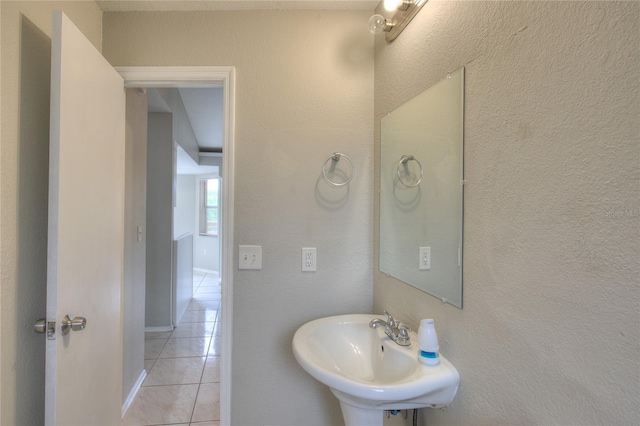 bathroom with tile patterned floors and a sink