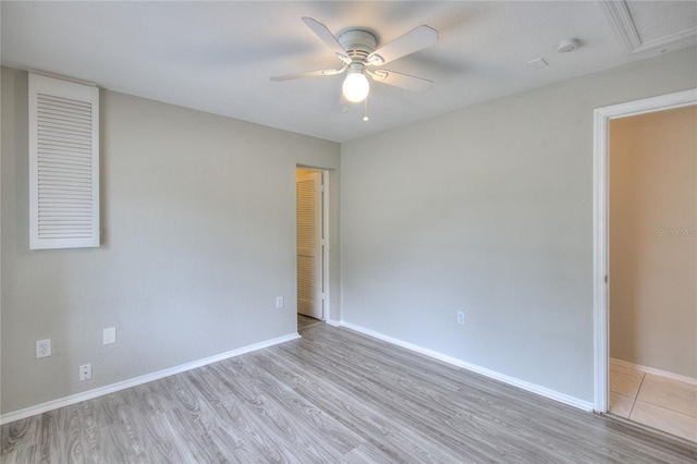 unfurnished bedroom with baseboards, ceiling fan, a closet, and light wood finished floors