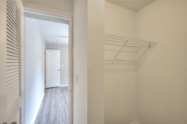 spacious closet featuring wood finished floors
