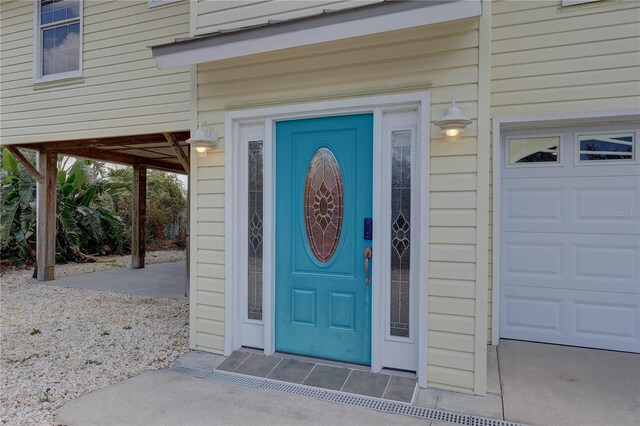 property entrance with a garage