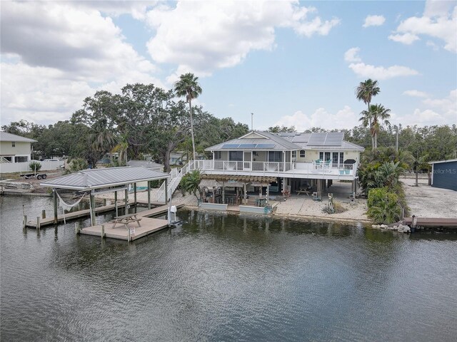 view of dock featuring boat lift and a water view