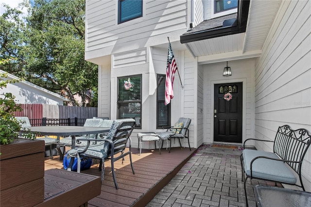 wooden deck featuring fence and outdoor dining area