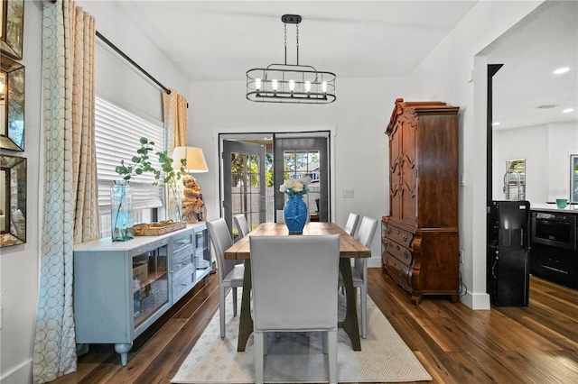 dining room featuring recessed lighting, a notable chandelier, and wood finished floors