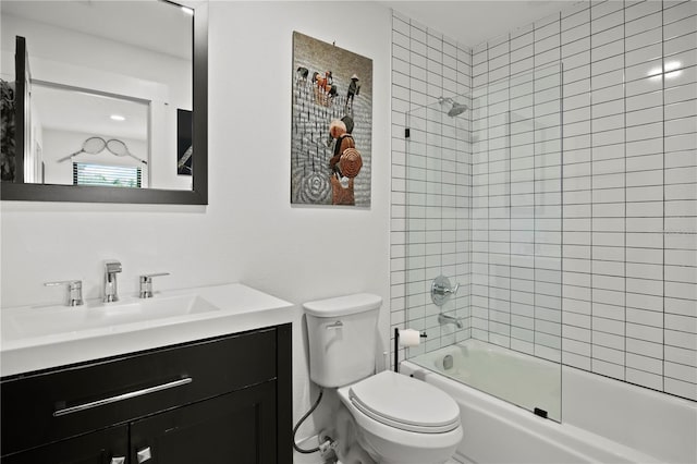 bathroom with vanity, toilet, and shower / washtub combination