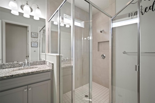 bathroom with vanity and a shower stall