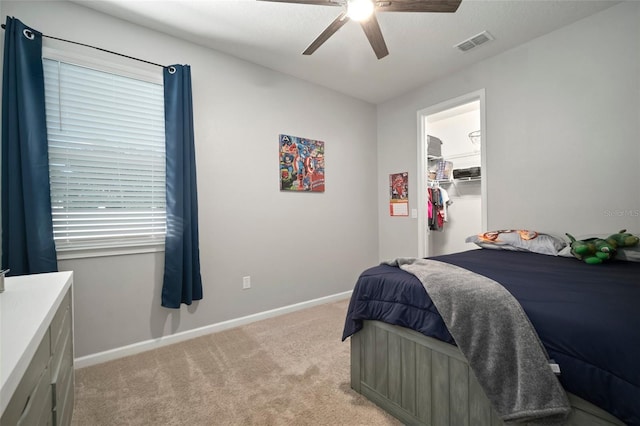 bedroom featuring light colored carpet, baseboards, ceiling fan, and visible vents