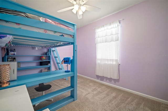 bedroom with baseboards, a ceiling fan, and carpet
