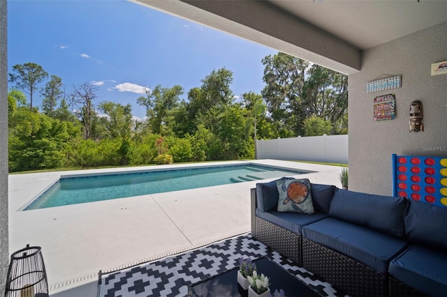 outdoor pool featuring fence, a patio, and an outdoor living space