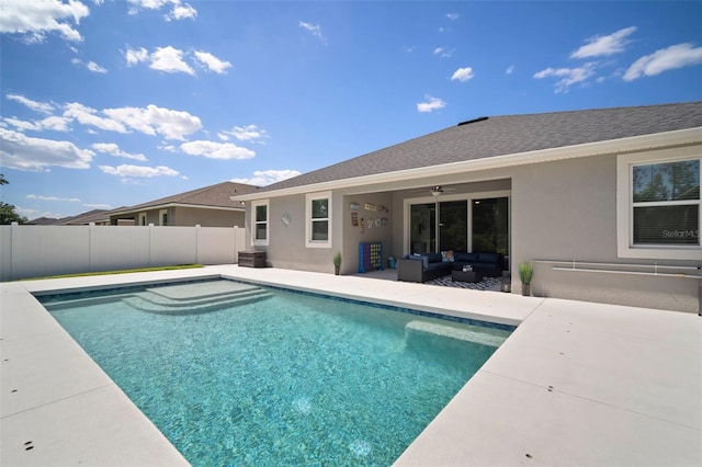 view of pool featuring a patio, outdoor lounge area, fence, ceiling fan, and a fenced in pool
