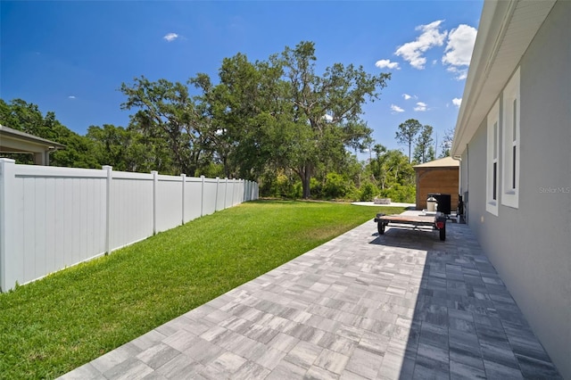 view of yard featuring a patio area and fence