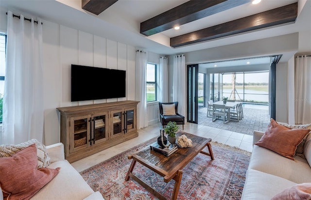 tiled living area with beamed ceiling