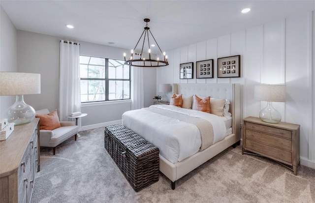 bedroom with baseboards, recessed lighting, a notable chandelier, and light carpet