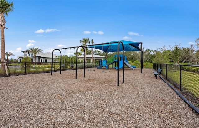 communal playground featuring fence