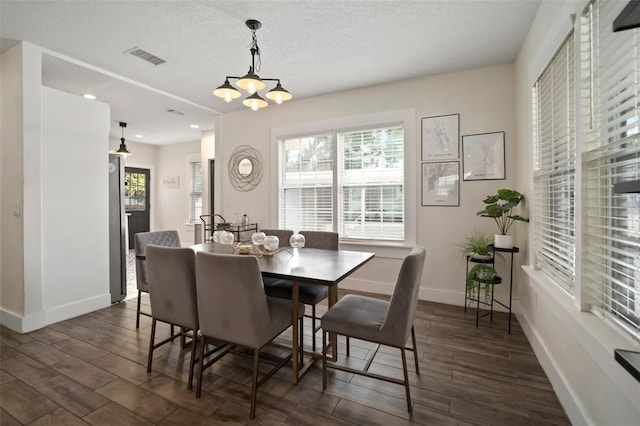 dining space with dark wood-style flooring, visible vents, baseboards, a chandelier, and recessed lighting